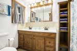 Ground level bathroom with a shower tub combo